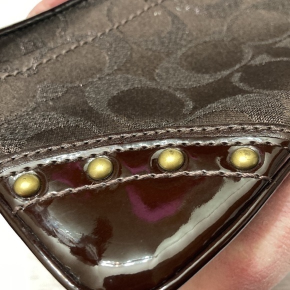 Coach brown copper metallic wristlet bag